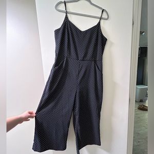 Navy wide leg jumpsuit with white polka dots and pockets
